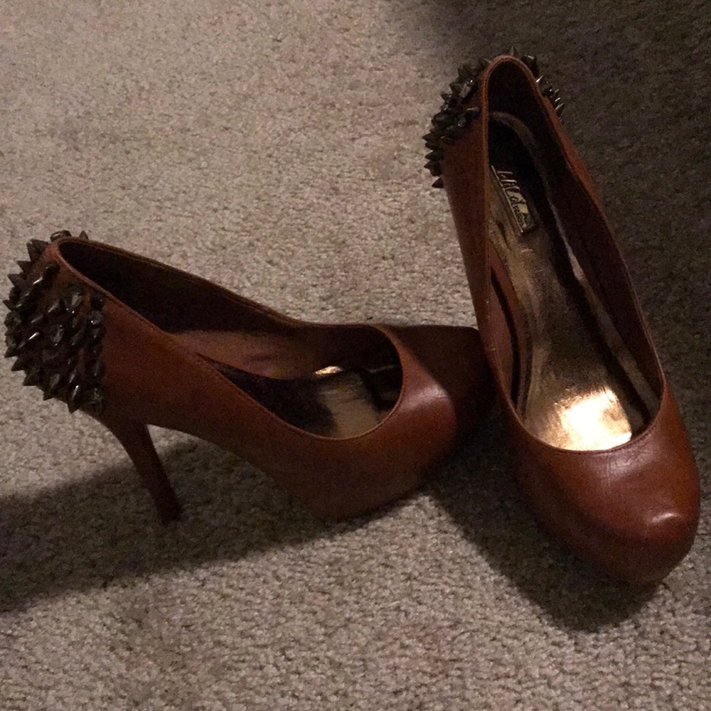 Spikes dark tan pumps from wild pair